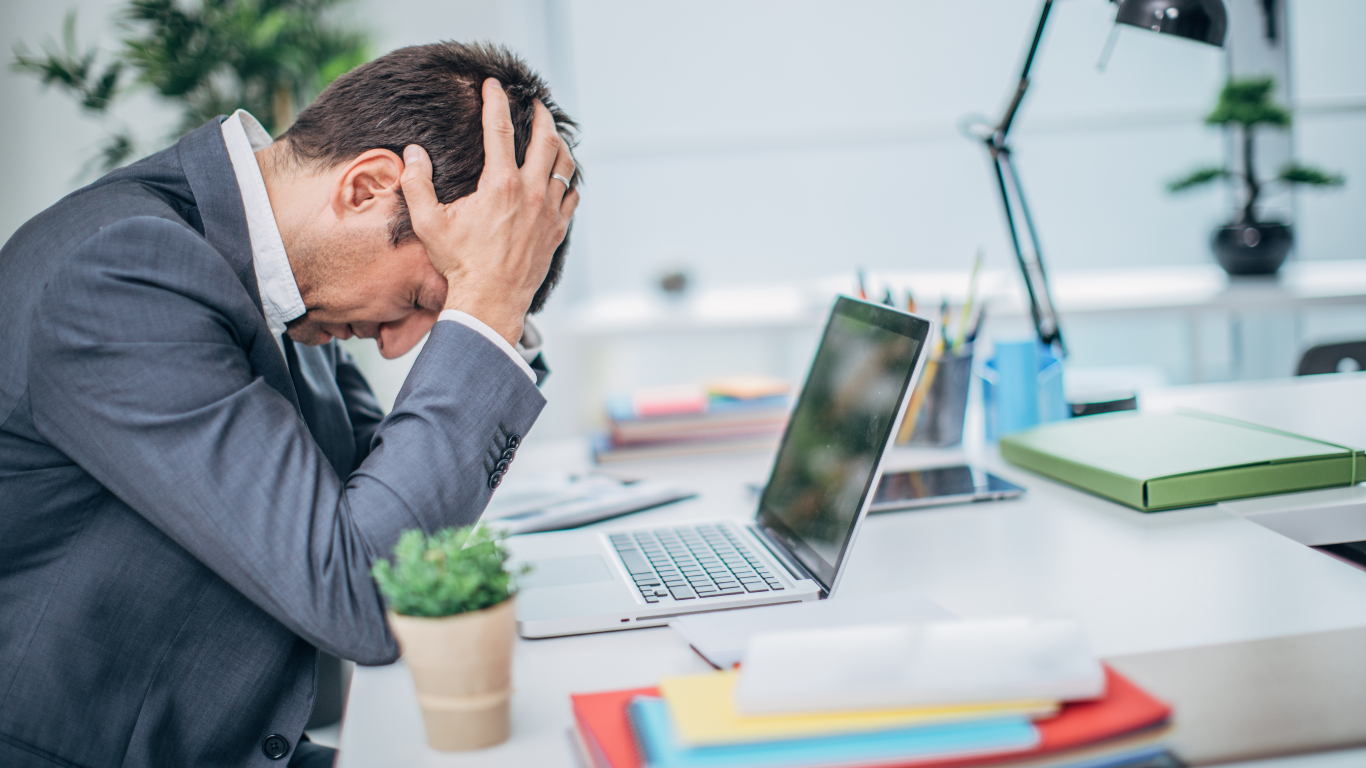 a man in distress with a computer issue